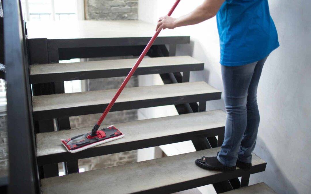 Cleaning service concept. Woman clean stair at home